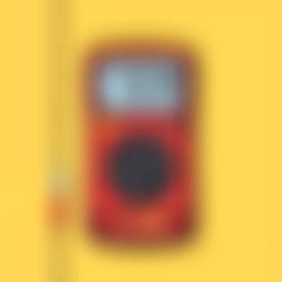 Multimeter showing a reading above 12.6V after the charging process.