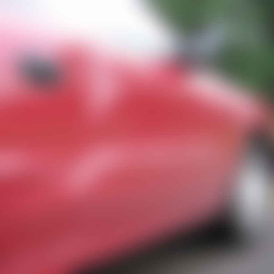 Car with various sizes of dents showcasing the need for dent repair