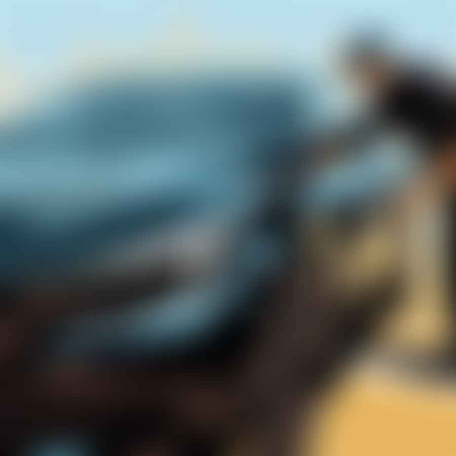 Clear coat being applied over touch-up paint on a car's surface
